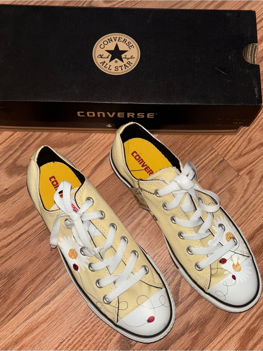 Converse Low Top Sneakers in Pale Yellow with Floral Accent